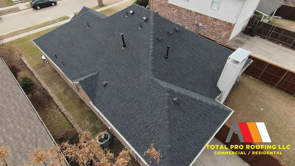 Aerial view of a black asphalt shingle roof installed by Total Pro Roofing LLC.