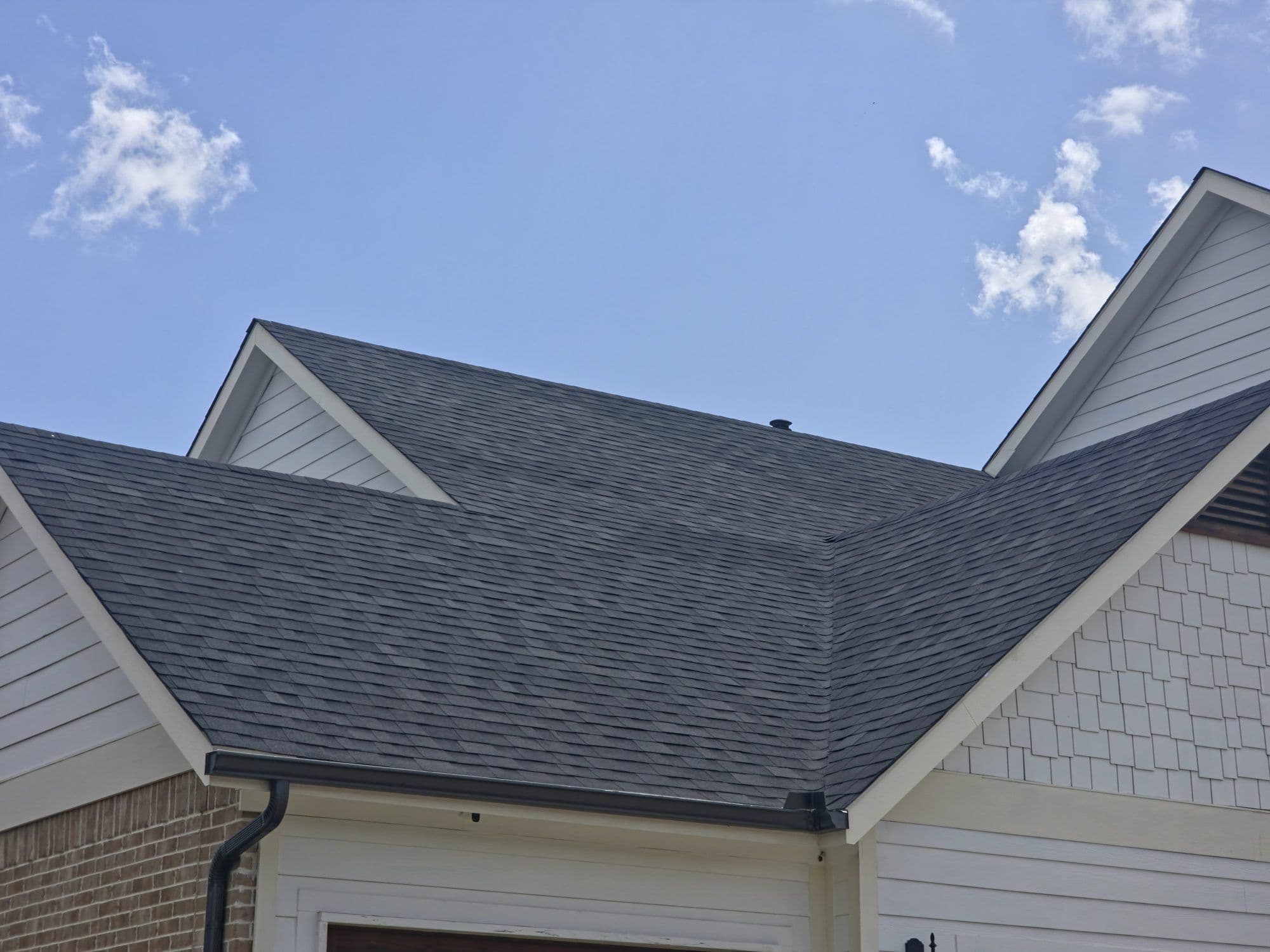 Roof valley and wall flashing on a shingle roof in the Dallas–Fort Worth area