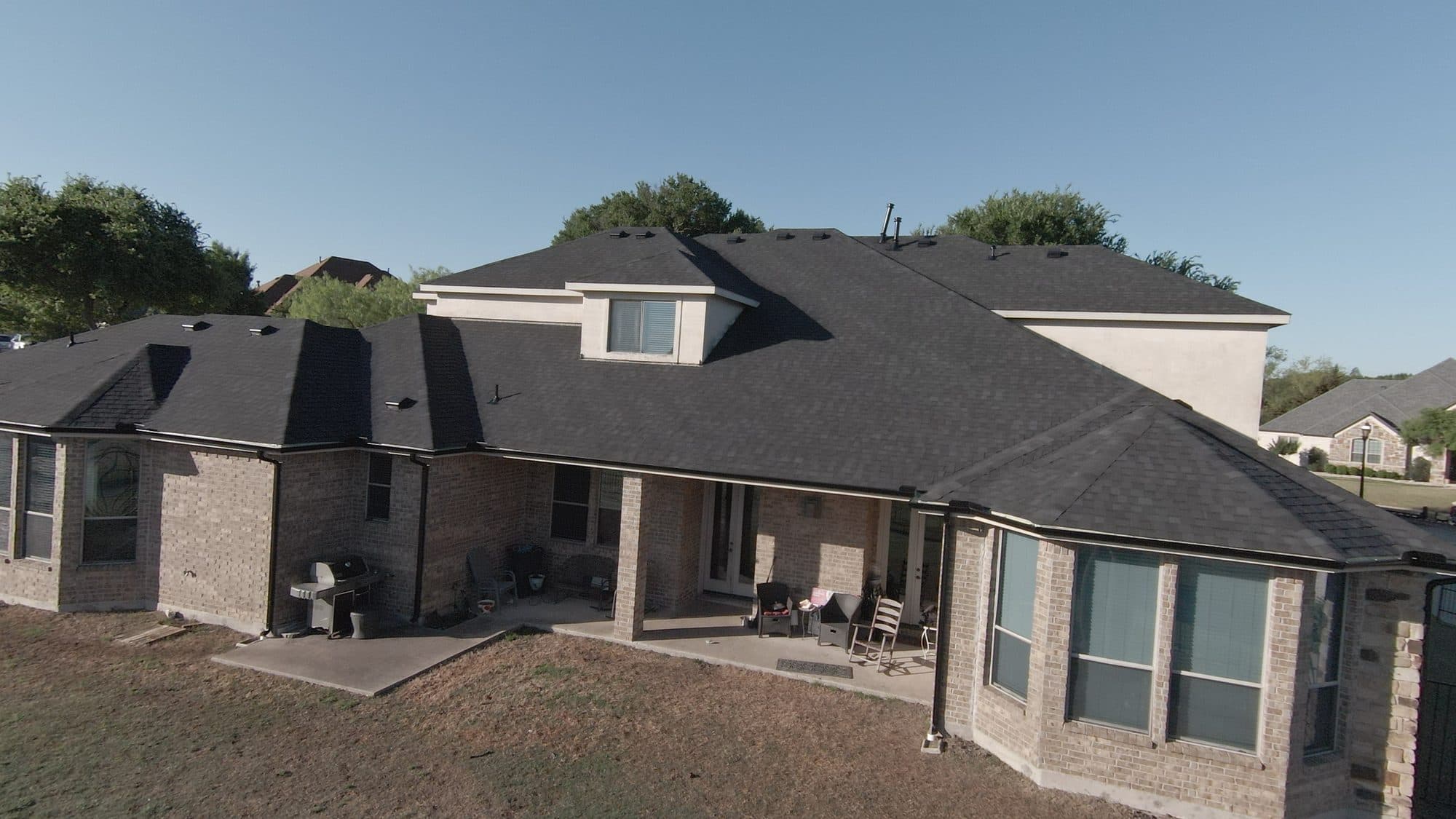 Finished shingle roof replacement on a two-story brick home in Sunnyvale, TX